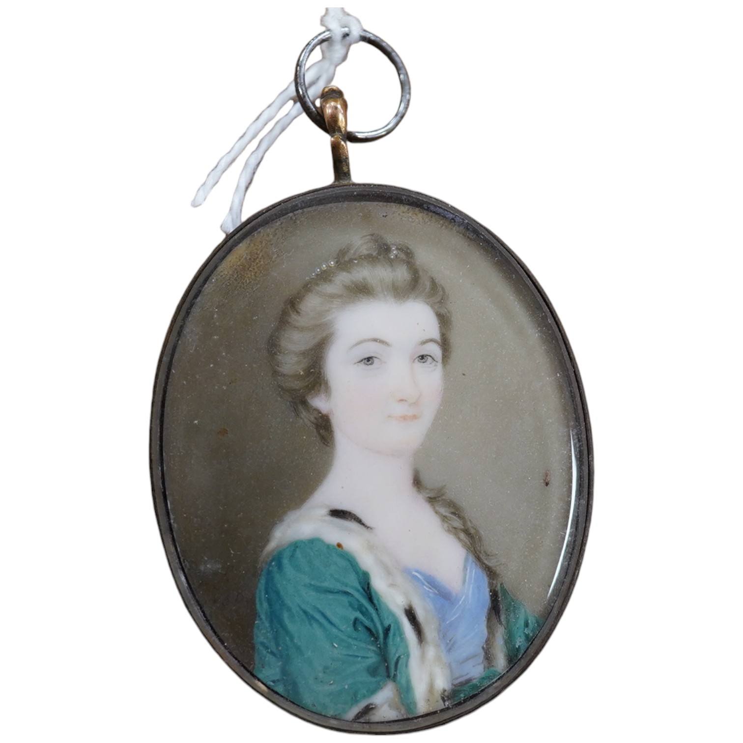 18th century School, Portrait miniature of a lady, indistinctly monogrammed and dated 1760? at 8 o'clock, 4 x 3cm. Condition - fair